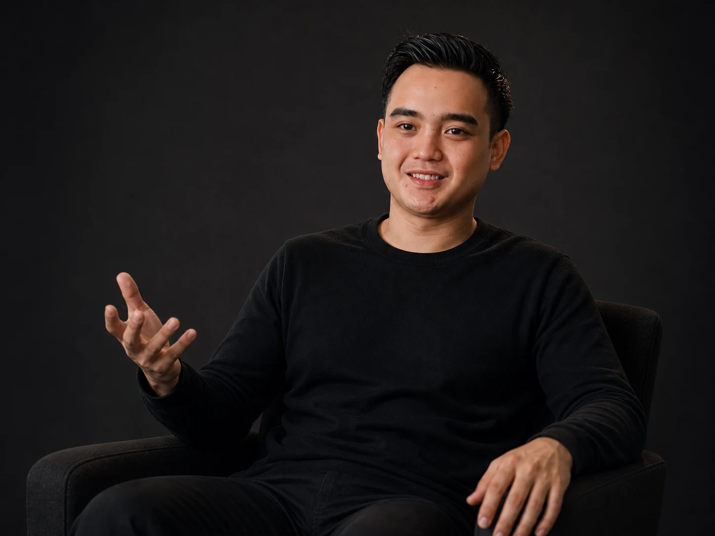 Akhmad Farizi seated in conversation